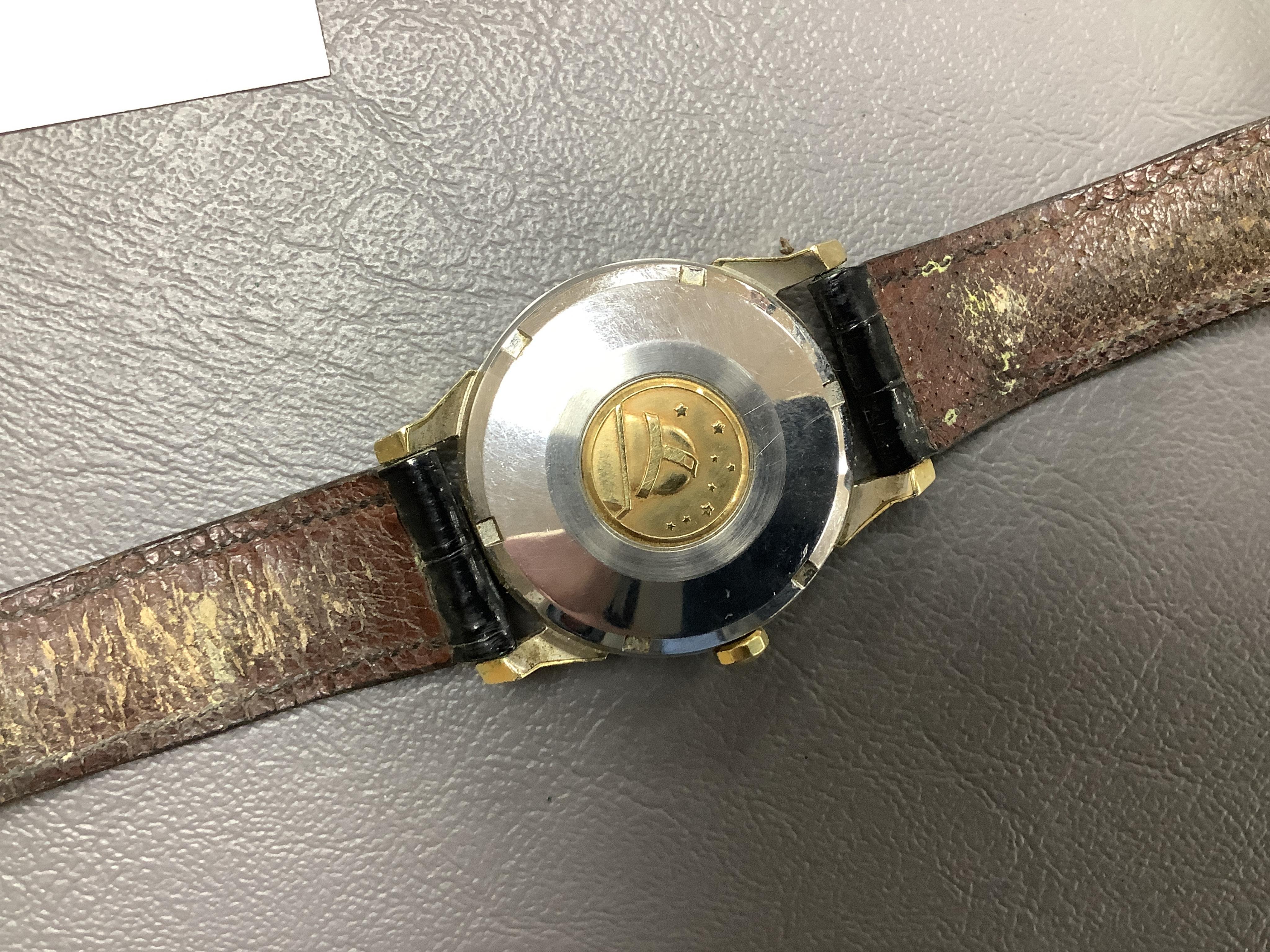 A gentleman's 1960's? steel and gold plated Omega Constellation Automatic Chronometer wrist watch, with baton numerals and date aperture, case diameter 35mm, on a leather strap with Omega gold plated buckle, no box or pa